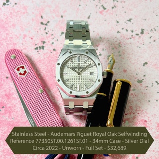Stainless Steel - Audemars Piguet Royal Oak Selfwinding Reference 77350ST.00.1261ST.01 - 34mm Case - Silver Dial Circa 2022 - Unworn - Full Set - $32,689  We are pleased to offer this unworn stainless steel Audemars Piguet Royal Oak Selfwinding with reference 77350ST.00.1261ST.01. This timepiece has the 34mm stainless steel case and bezel with a glareproofed sapphire crystal and caseback. It features a silver-toned dial with “Grande Tapisserie” pattern, white gold applied hour-markers and Royal Oak hands with luminescent coating on a stainless steel bracelet with an AP folding clasp. This watch will be delivered complete with the original Audemars Piguet outer cardboard box, inner Boutique Edition display box, Instructions for use book, World-wide service manual, Certificate of Origin and Guarantee dated April 2022.
